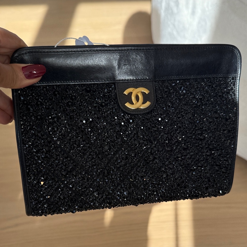 CHANEL Black Beaded Pouch with Gold Logo